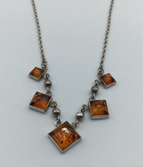 Sterling silver and amber pendant.